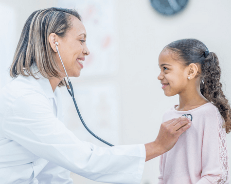 A locum tenens doctor gives treatment to a child